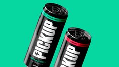 two cans of energy drink on a green background