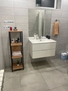 the bathroom is clean and ready for us to use it's own storage rack