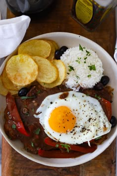 a plate topped with an egg, toast and fruit