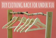 clothes hangers are hanging on a pink background with the words diy clothing rack