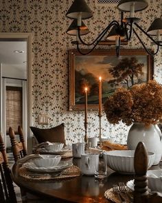 a dining room table with plates and cups on it