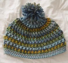 a crocheted hat is shown with the text aruga stitch hat free crochet pattern in 4 sizes by underground coffee