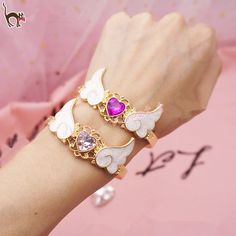 Magical Bracelet, Angel Wings Bracelet, Magic Bracelet, Angel Wing Bracelet, Magical Girl Aesthetic, Heart Bracelets, Fairy Stuff, Heart Wings, Magical Boy