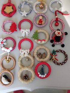 many wreaths and ornaments are arranged on a table