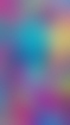 a blurry image of blue, pink and green colors on a wallpaper background