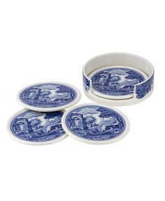 four blue and white plates with animals on them