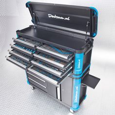 a toolbox with many drawers and tools in it's trays on a white background