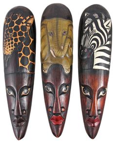 three african masks with animals and zebras on them