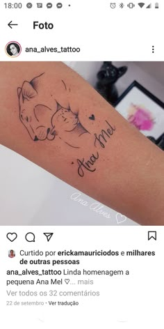 a tattoo on the arm of a woman with two cats and an inscription in spanish