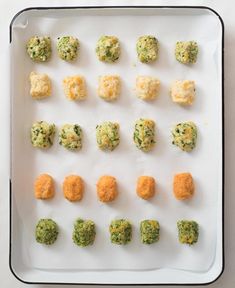 an overhead view of broccoli and cauliflower bites on a white tray