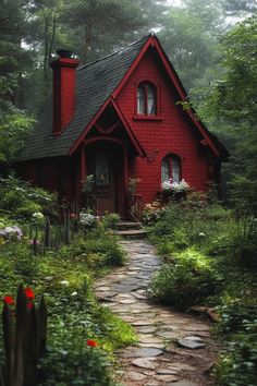 a small red house in the woods surrounded by greenery