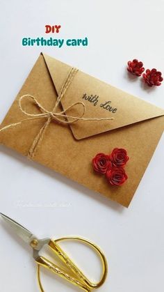 a pair of scissors sitting next to an envelope with roses on it and the words, diy birthday card