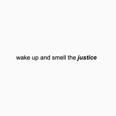 the words wake up and smell the justice written in black