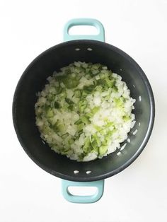 onions and celery are being cooked in a pan