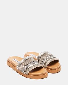 1.25 inch heel height Microsuede upper material with rhinestones Microsuede lining Vegan leather sock Synthetic sole Imported Sandals Steve Madden, Rhinestone Slides, Steve Madden Store, Apparel Merchandising, Slides Women, Leather Socks, Women's Sandals, Steve Madden, Vegan Leather