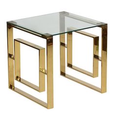 a glass and gold end table with metal legs