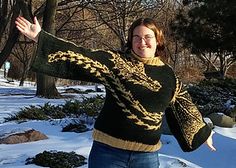 a woman is standing in the snow with her arms spread out and she's smiling