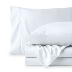 white sheets and pillowcases on a white background