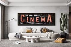 a living room filled with furniture and a large sign on the wall above it that reads, the davis family cinema