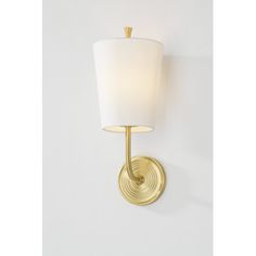 a wall light with a white shade on it's side and a gold finish