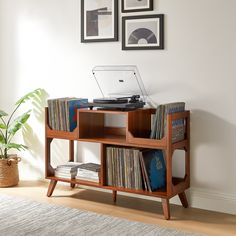 a record player is sitting on top of a shelf