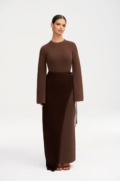 Elevate your wardrobe with our Grace Knit Maxi Dress & Wrap Skirt Set. The subtle flare sleeves add a touch of sophistication, while the color contrasting knit creates a unique and elegant look. With the versatility of a dress and wrap skirt, this set is a must-have for any wardrobe. Model is 5'6 and is wearing size S/56". Fall Wrap Dress Outfit, Knitted Maxi Skirt Outfit, Dresses Fall 2024, Wrapped Skirt Outfit, Holiday Outfits For Curvy Women, Red Skirt Outfit Winter, Cool Undertones Clothes, Knit Maxi Skirt Outfit, Maxi Skirt Outfit Fall