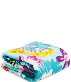 two blankets folded on top of each other in different colors and patterns, one with an elephant