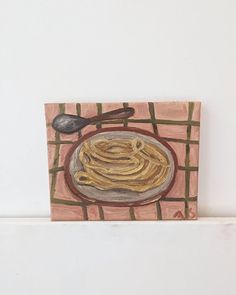 a painting of some kind of food on a plate with a spoon and fork next to it