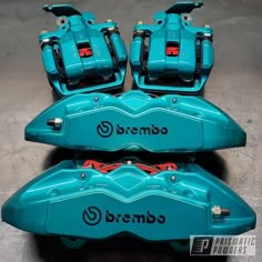 the front and rear brake pads of a blue motorcycle