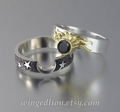 "Simple yet sophisticated, this elegant engagement ECLIPSE set is full of meanings and symbolism. The engagement SUN ring is made of 14K white gold with 18K yellow gold bezel. The gemstone is a natural 5 mm black diamond (about 0.59 Ct). The ring's shank is 5mm wide. Beautiful on its own, the ring reaches its full magnificence when united with the starred white gold wedding MOON band. The crescent Moon and the Sun, seen by the ancients as the God and the Goddess, a symbol of the duality of deity Elegant Yellow Gold Rings With Sun And Moon Design, Celestial Sun And Moon Design Rings For Anniversary, Elegant Gold Rings With Sun And Moon Design, Celestial Rings With Sun And Moon Design For Anniversary, Elegant Sun And Moon Design Jewelry For Promise, Elegant Sun And Moon Design Jewelry For Promise Occasion, Elegant Sun And Moon Design Promise Rings, Sun And Moon Design Wedding Ring, Elegant Sun And Moon Design Rings For Anniversary