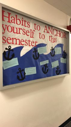 a bulletin board is hanging on the wall with anchor sayings and notes attached to it