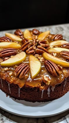 a cake with apples and pecans on top