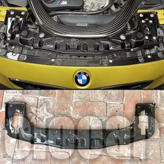 the front end of a yellow bmw car with its hood up and engine cover open