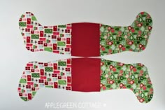 two oven mitts made out of red and green fabric