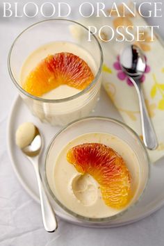 two desserts on a white plate with spoons