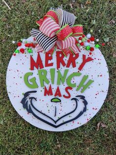 a merry grinmas sign on the grass