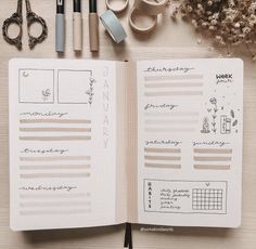 an open notebook with writing on it next to some scissors and other office supplies,