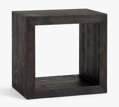 a square wooden object with one section cut out