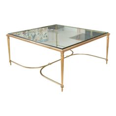 A well-proportioned, square Louis XVI style brass coffee table with a heavy inset glass top, gently tapered and fluted legs and a gracefully swept cross-form stretcher.   Product Information: Materials: Brass, Glass Dimensions: 36” W x 36” D x 16.5” H  Style: Louis XVI  Condition: Very good vintage condition. Minor surface wear consistent with age and use. Structurally sound.  Shipping: $650  About Us: We curate antique, vintage and high-end, gently-used home furnishings sourced from some of the Brass Coffee, Glass Tables, Square Coffee Table, Brass Coffee Table, Louis Xvi Style, Coffee Table Square, Brass Glass, Glass Coffee Table, Living Room Inspo