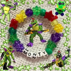 there is a bracelet made out of plastic toys and letters that spell out the word money