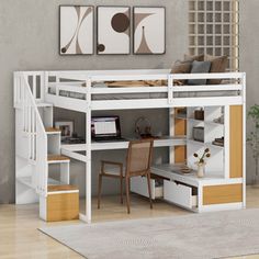 a loft bed with desk underneath and stairs to the bottom level, in front of a gray wall