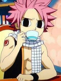 an anime character with pink hair sitting at a table in front of a coffee cup