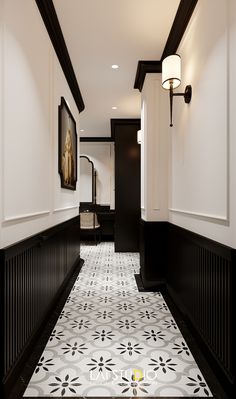 the hallway is decorated in black and white with an intricate tile pattern on the floor