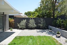 the back yard is clean and ready to be used as an outdoor space for entertaining