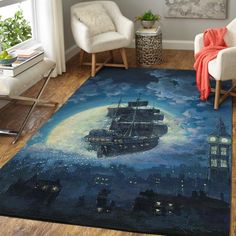 a living room with a rug that has a ship in the sky on top of it