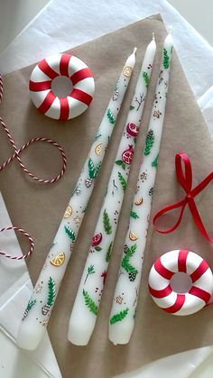 christmas candles and candy canes on a napkin