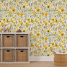 the wallpaper in this room has yellow flowers on it and is next to a wicker basket