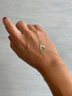 Add a sophisticated touch to your jewelry collection with this stunning Sterling Silver Emerald Hand Chain Bracelet. Featuring a dazzling emerald-green zircon stone, this bracelet is perfect for women who love elegant yet versatile jewelry. *Material: Made of premium 925 sterling silver with a gold-plated finish, ensuring durability and hypoallergenic wear. *Design: A delicate hand chain adorned with a sparkling emerald-green zircon stone, offering a boho-chic vibe that suits any style. *Occasio Hand Chain Bracelet Gold, Gold Hand Jewelry, Boho Wedding Jewelry, Hand Chain Bracelet, Engagement Gifts For Her, Versatile Jewelry, Gold Hand, Hand Chain, Christmas Gift Jewelry