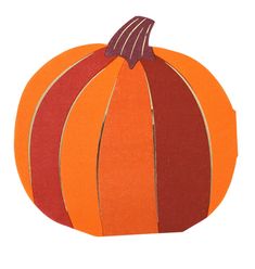 an orange and red striped pumpkin cut out from construction paper on a white background with clippings