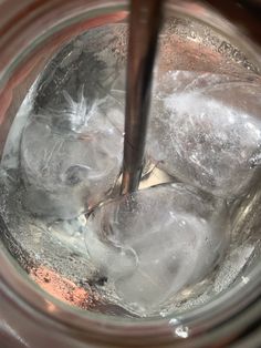 an ice bucket filled with water and ice